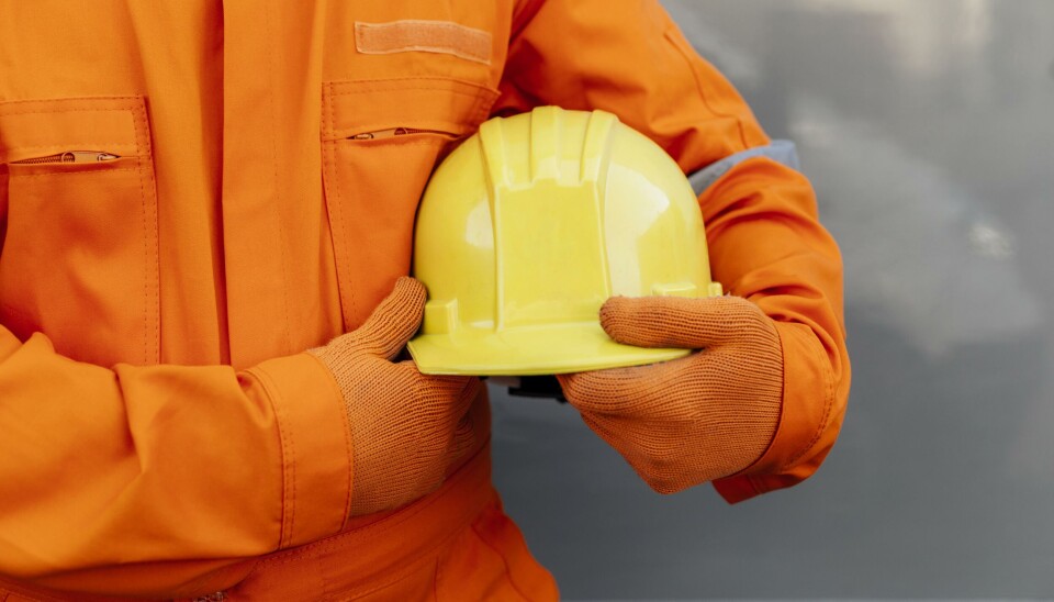 front view worker uniform holding hard hat 2. Resolution and high quality beautiful photo
